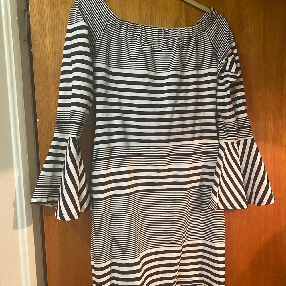 Off the shoulder black & white patterned soft knit dress with flared sleeves.